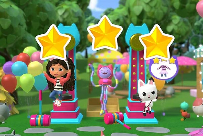 Mädchen mit Katzen und Sternen auf Podium im Spiel "DreamWorks Gabby’s Dollhouse: Bereit für die Party"; Bild: Outright Games