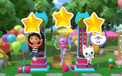 Mädchen mit Katzen und Sternen auf Podium im Spiel "DreamWorks Gabby’s Dollhouse: Bereit für die Party"; Bild: Outright Games Mädchen mit Katzen und Sternen auf Podium im Spiel "DreamWorks Gabby’s Dollhouse: Bereit für die Party"; Bild: Outright Games