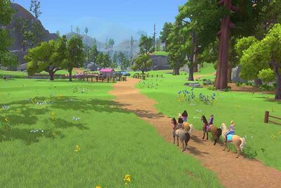 Spielfiguren reiten zusammen im Spiel "Barbie™ Reitwege"; Bild: Outright Games